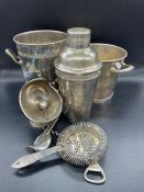 A selection of silver plated items to include, ice bucket, bottle holder, cocktail shaker etc.