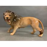 A Beswick prowling Lion (H17cm W28cm)