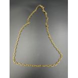 An 18ct (750) gold necklace (Total Weight 23.5g), total length 61 cm.