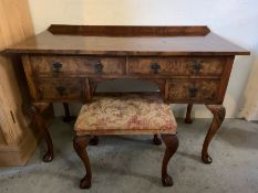 A walnut dressing table with gallery back with two long drawers and two short on pad feet and