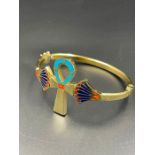 An Arabian gold bangle (Total Weight 19.4g) with enamel decoration.