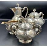 A Four Piece 19th/20th Century Silver tea Service by Tuck Chang and Co, in original box with