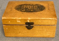 An Mauchline ware box with wells promenade, Ilkley to front