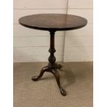 A George III style tripod table with circular top, three down swept legs (H58cm Dia 42cm)