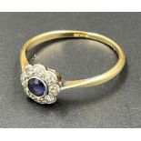 An 18ct gold sapphire and diamond daisy ring