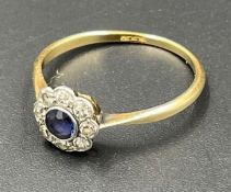 An 18ct gold sapphire and diamond daisy ring