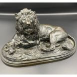 A Bronze of a recumbent lion in the manner of Edouard Delabrierre (French 1829-1912) signed