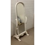 A floor standing white swivel cheval mirror