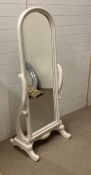 A floor standing white swivel cheval mirror