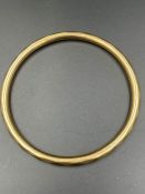 A 15ct gold bangle (Total weight 10.5g)