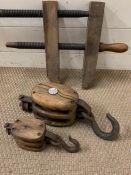 Vintage wooden clamps and two pulleys