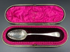 A Boxed silver sugar sifter spoon, hallmarked for Birmingham 1893 by H J Cooper & Co Ltd