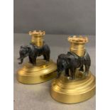 A pair of elephant bronzed candlesticks on gilt bases (H9.5cm W9cm)