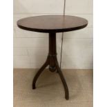 A mahogany side table on out sprayed rocket shaped legs