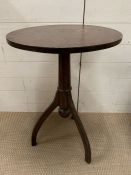 A mahogany side table on out sprayed rocket shaped legs
