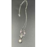 An 18ct white gold pearl pendant and chain (Total Weight 5.6g)