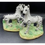 A Pair of Staffordshire Zebra figures