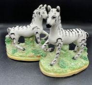 A Pair of Staffordshire Zebra figures