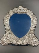 A silver heart shaped photo frame with easel back, hallmarked for Sheffield 1992 by Carr's of