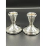 A pair of squat silver candlesticks by C Ltd, hallmarked for Birmingham 1978