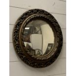 A circular wall mirror with carved surrounds (Dia45cm)