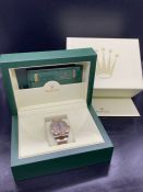 A Rolex Oyster Perpetual, with box and papers