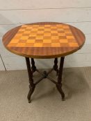 A side table with checker board to top (H63cm Dia56cm)