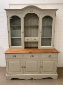 A painted Welsh dresser with glazed doors and cupboards below (H205cm W153cm D62cm)