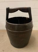 A wooden vintage churn or bucket with metal banding