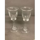 Two Bell wine glasses with thick stem and collars on circular base