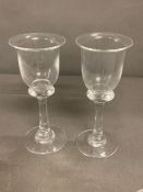 Two Bell wine glasses with thick stem and collars on circular base