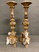 A pair of gilt contemporary candlesticks