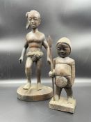 Two wooden carved figures.