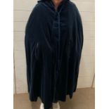A navy cape with hood and rope tie (Size UK 12-14)