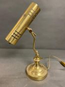 A brass reading lamp