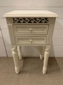 A painted bedside with two drawers