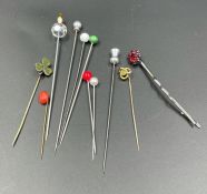 A selection of various hat pins and lapel pins