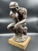 A Plaster statue in the manner of the thinker