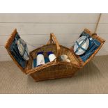 A wicker hamper by Optima, four place setting