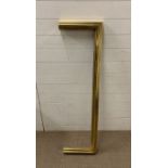 A brass fireside surround (W138cm)