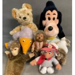 A selection of soft children's toys to include wombler characters, monkey hand puppet and softy