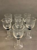 Seven Bell glasses with twisted stem and cobalt blue collar on circular base
