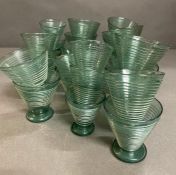 A large selection of Art Deco style ribbed glasses in three sizes