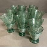 A large selection of Art Deco style ribbed glasses in three sizes