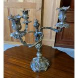 A three armed silver plated candlestick