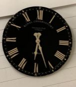 A contemporary wall clock with roman numerals