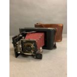 A vintage camera by Kodak USA in a leather carry case