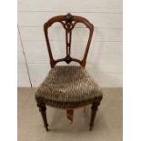 A Victorian dining chair with turned legs
