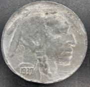 A cast counterfeit 1937-D 3 legged Buffalo nickel.