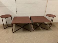 An industrial style metal tables. Two square and two circular with X frames.
